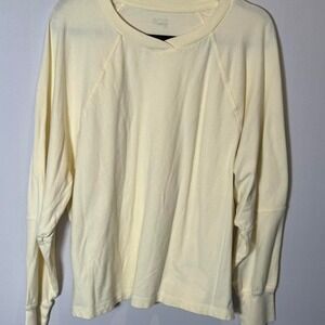 Butter yellow long sleeve shirt with a relaxed fit